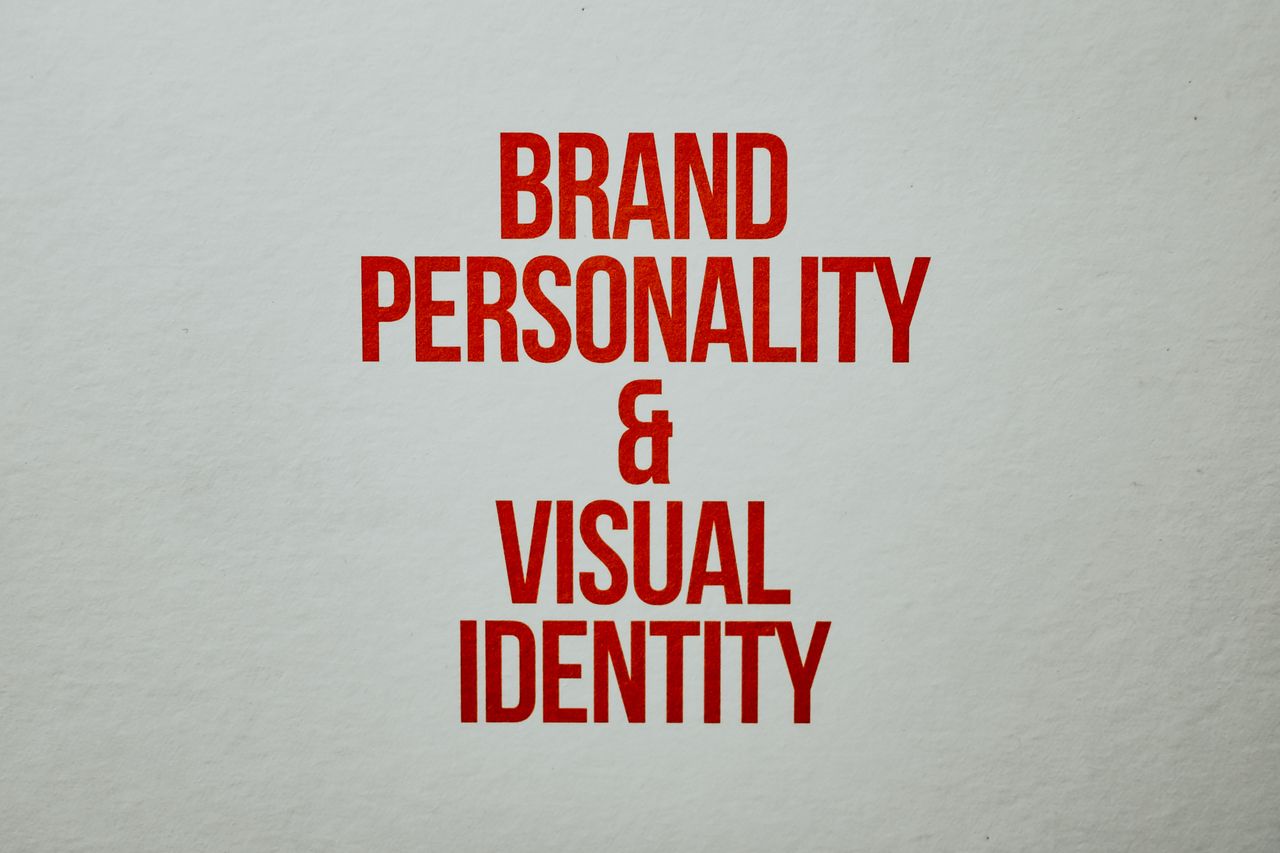 hero-img Red text emphasizing brand personality and visual identity on a neutral background.
